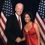 Joe biden and a woman in a red dress.