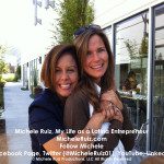 Two women are posing for a photo in front of a building.