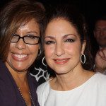 Two women posing for a photo at an event.